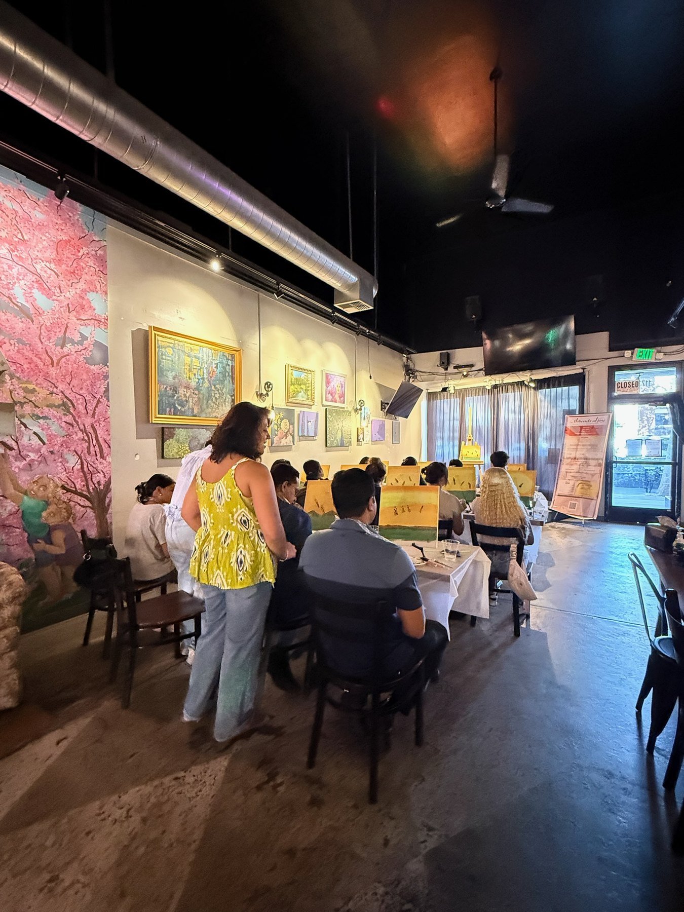 A wider view of the Brush Hour painting room at Wheelhouse in Downtown Willow Glen.